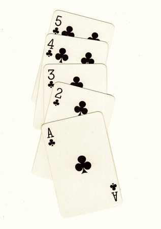 Playing cards on a white background, close-up of photo.