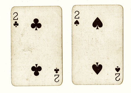 old playing cards on a white background, top view, close-up