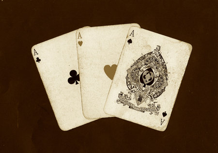 Playing cards on a black background in a casino, closeup of photo