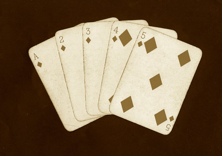 poker playing cards on a black background, closeup of photo