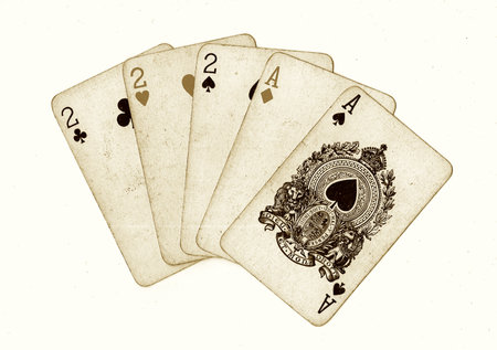 old playing cards on a white background, close-up of photo