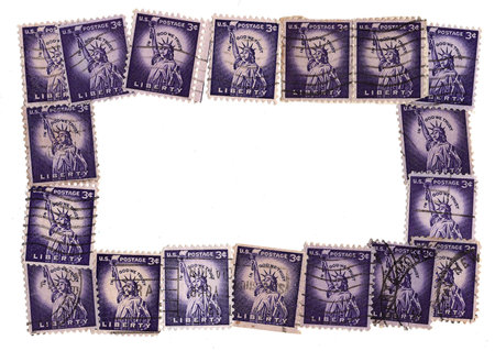 A collection of old postage stamps from the United States of America.の写真素材