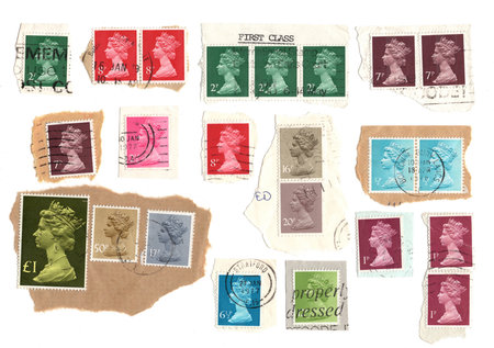 Vintage Queen Elizabeth II postage stamps from Great Britain isolated on a white background.の写真素材