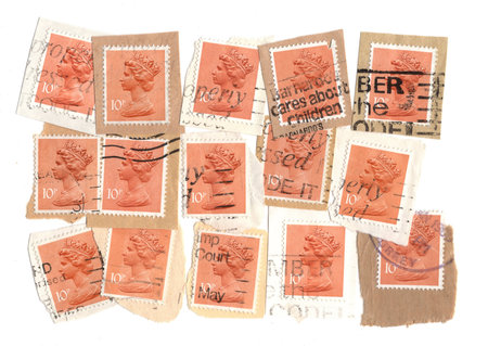 Vintage Queen Elizabeth II postage stamps from Great Britain isolated on a white background.の写真素材