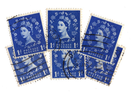 Vintage Queen Elizabeth II postage stamps from Great Britain isolated on a white background.の写真素材