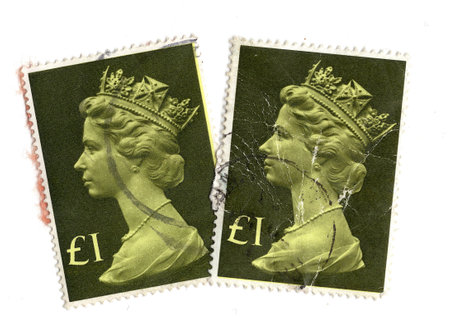 Vintage Queen Elizabeth II postage stamps from Great Britain isolated on a white background.の写真素材