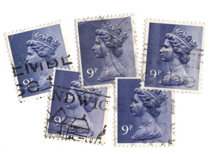 Vintage Queen Elizabeth II postage stamps from Great Britain isolated on a white background.