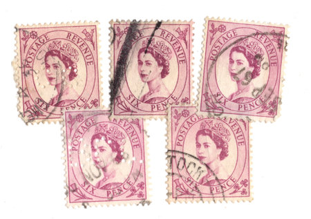 Vintage Queen Elizabeth II postage stamps from Great Britain isolated on a white background.