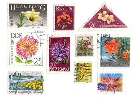 Vintage postage stamps from around the world isolated on a white background.の写真素材