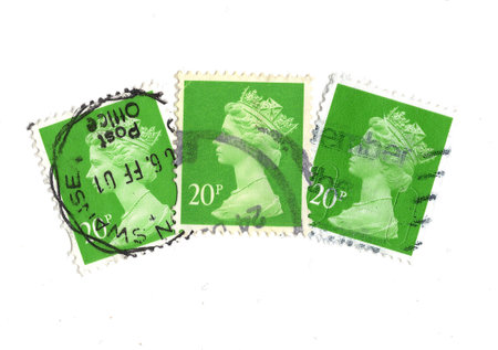 Vintage Queen Elizabeth II postage stamps from Great Britain isolated on a white background.の写真素材