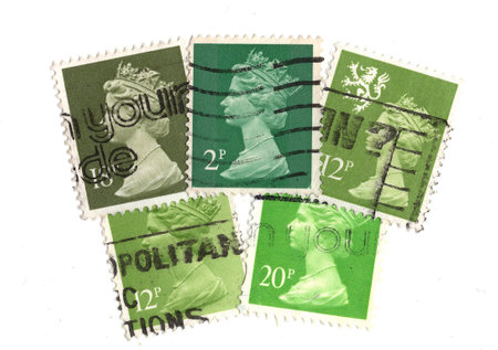Vintage Queen Elizabeth II postage stamps from Great Britain isolated on a white background.の写真素材