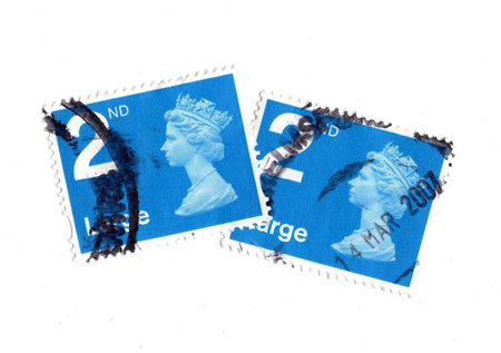 Vintage Queen Elizabeth II postage stamps from Great Britain isolated on a white background.