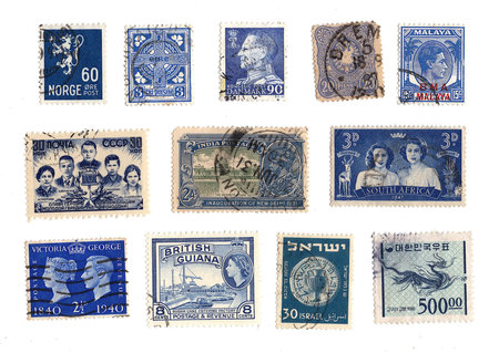 Vintage postage stamps from around the world on a white background.の写真素材