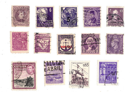 Vintage postage stamps from around the world on a white background.の写真素材