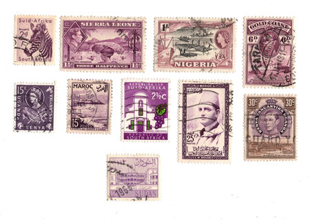 Collection of old postage stamps from different countries. Isolated on white background.の写真素材