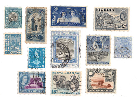 Collection of old postage stamps from different countries. Isolated on white background.の写真素材