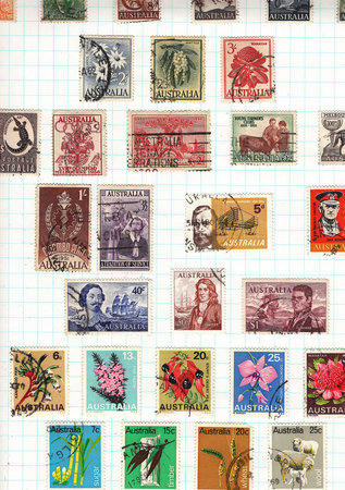 Vintage postage stamps from Australia on a stamp album page.の写真素材