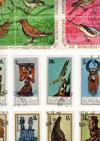 Vintage postage stamps from Burundi on a stamp album page.の写真素材