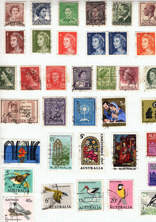 Vintage postage stamps from Australia on a stamp album page.の写真素材