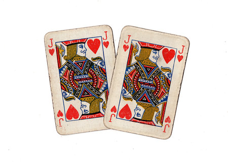 A pair of identical vintage playing cards isolated on a white background.