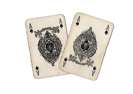 A pair of identical vintage playing cards isolated on a white background.