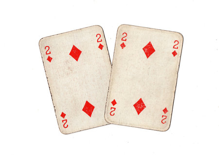 A pair of identical vintage playing cards isolated on a white background.