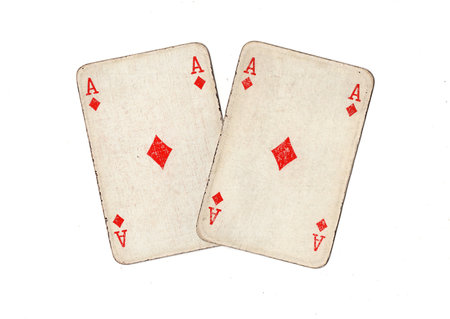A pair of identical vintage playing cards isolated on a white background.