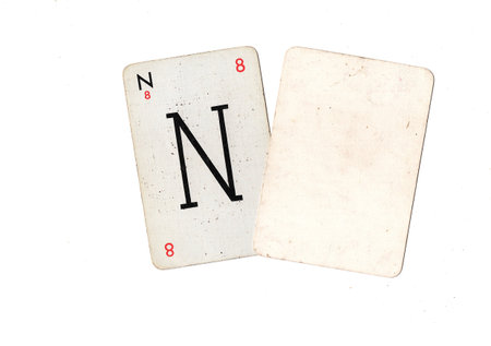 A vintage alphabet playing card with one blank card for text or copy on a white background.の写真素材
