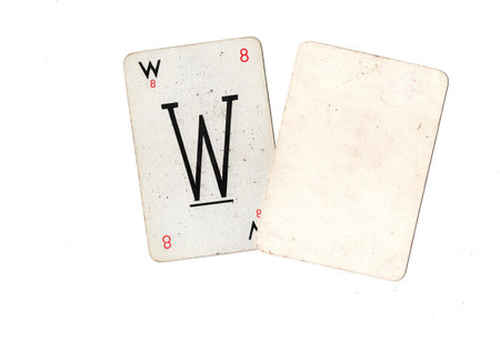 A vintage alphabet playing card with one blank card for text or copy on a white background.の写真素材