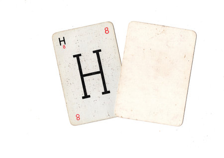 A vintage alphabet playing card with one blank card for text or copy on a white background.の写真素材