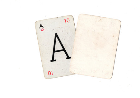 A vintage alphabet playing card with one blank card for text or copy on a white background.の写真素材