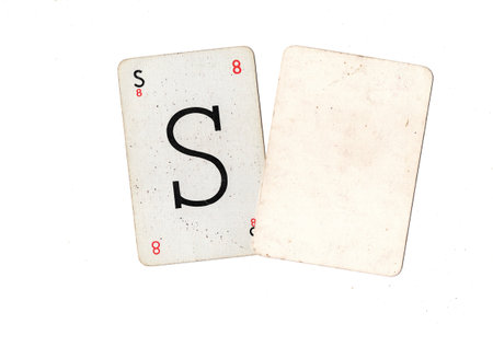 A vintage alphabet playing card with one blank card for text or copy on a white background.の写真素材