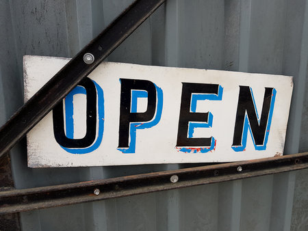 Open sign on the metal door.の写真素材