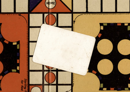 Close up detail of a vintage Ludo board game with a panel for text.の写真素材
