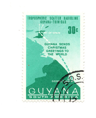 A vintage postage stamp from Guyana isolated on a white background.の写真素材