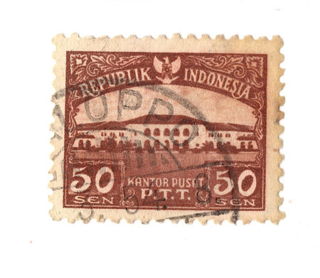 A vintage postage stamp from Indonesia isolated on a white background.の写真素材