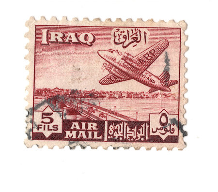 A vintage postage stamp from Iraq isolated on a white background.