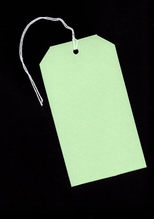 Price tag or address label with string on black background. Price tag or address labelの写真素材