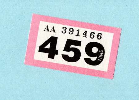 A single raffle ticket on a brightly coloured background.の写真素材