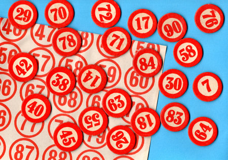 Red and white lottery numbers on a blue background. Top view.