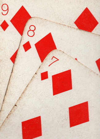 Close up detail of a run of three vintage  playing cards.の写真素材