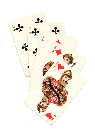 A hand of vintage Russian playing cards isolated on a white background.