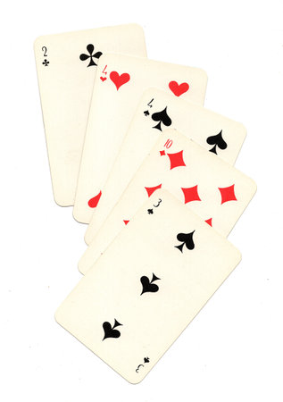 A hand of vintage Russian playing cards isolated on a white background.