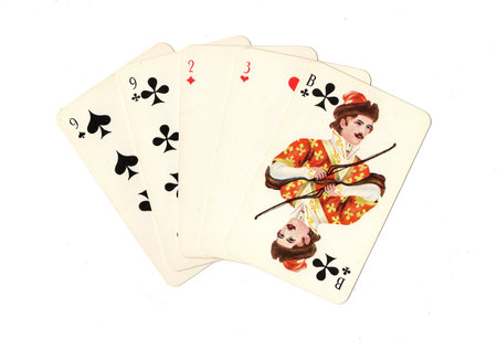 A hand of vintage Russian playing cards isolated on a white background.