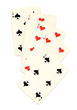A hand of vintage Russian playing cards isolated on a white background.