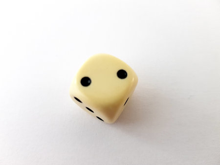 A single dice isolated on a white background.の写真素材