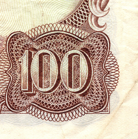 A decorative detail from a vintage banknote.