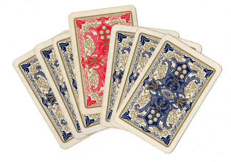 A hand of blue vintage playing cards with one red card.
