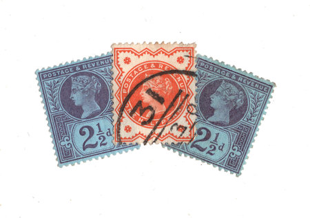 Vintage Queen Victoria postage stamps from Great Britain isolated on a white background.