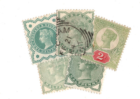 Vintage Queen Victoria postage stamps from Great Britain isolated on a white background.